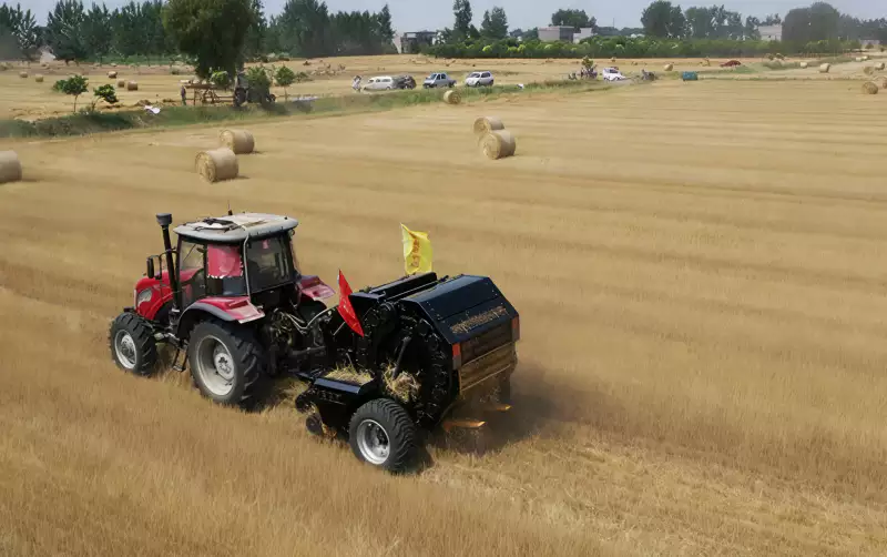 Tractor Baler Operating in Field